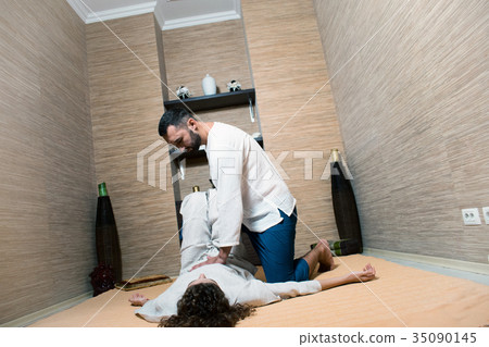 man and woman in white doing gymnastics 35090145