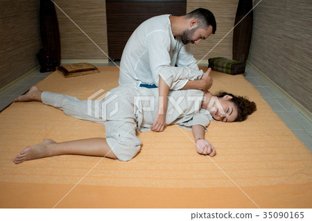 man and woman in white doing gymnastics man and woman in white doing gymnastics 35090165