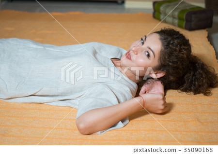 smiling woman shows tongue 35090168