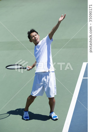 A man playing tennis A man playing tennis 35090171