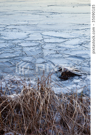 Pieces of ice in lake 35090185