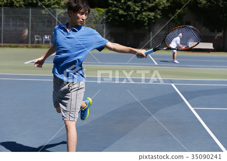 A man playing tennis A man playing tennis 35090241