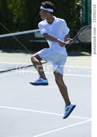 A man playing tennis A man playing tennis 35090318