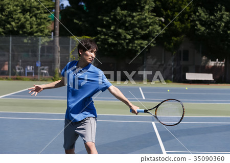 A man playing tennis A man playing tennis 35090360