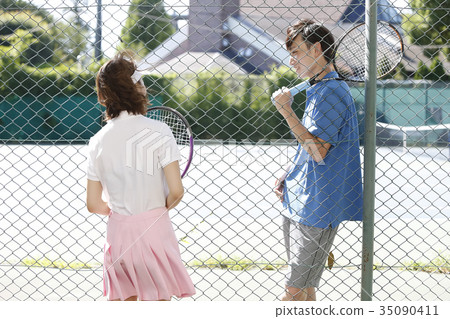 Woman in tennis court Woman in tennis court 35090411