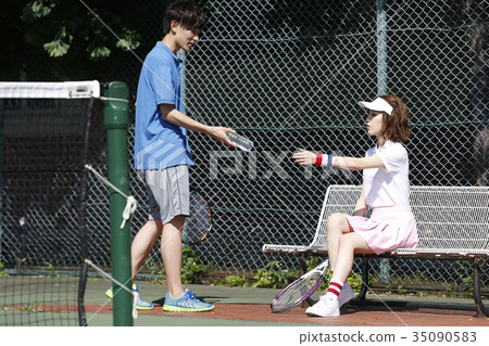 Men and women in the tennis court Men and women in the tennis court 35090583