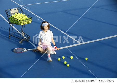 Woman in tennis court Woman in tennis court 35090689