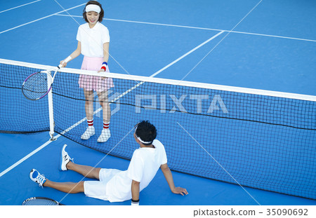 Men and women in the tennis court Men and women in the tennis court 35090692