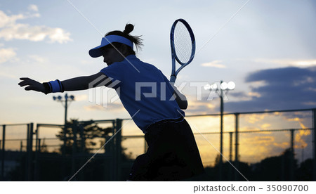 A woman playing tennis 35090700