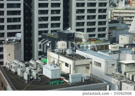 The roof of a building where outdoor units line up 35092006