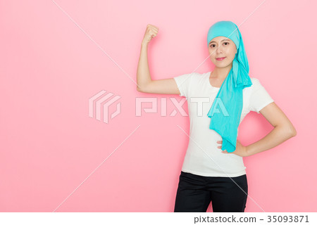 cancer woman showing powerful strength muscle 35093871