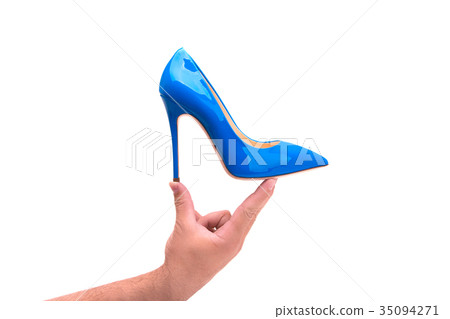 Blue lacquered female shoes in a male hand Blue lacquered female shoes in a male hand 35094271