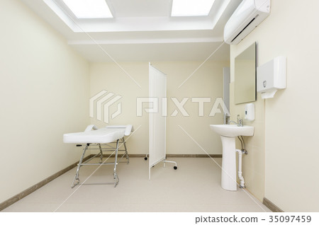 Massage room with empty table Massage room with empty table 35097459
