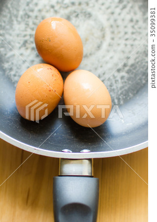 Fresh eggs in a pan 35099381