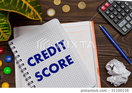 Notebook with a notes CREDIT SCORE on the office Notebook with a notes CREDIT SCORE on the office 35100236