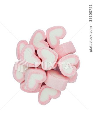 Pink heart shaped marshmallows isolated on white Pink heart shaped marshmallows isolated on white 35100731