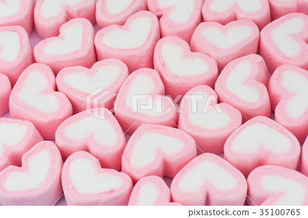 Pink heart shaped marshmallows background Pink heart shaped marshmallows background 35100765