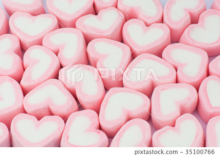 Pink heart shaped marshmallows background Pink heart shaped marshmallows background 35100766