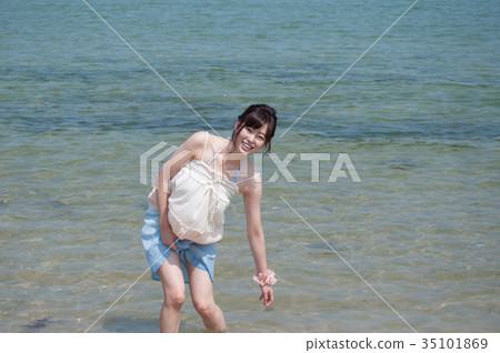 Women playing in shallow water Women playing in shallow water 35101869
