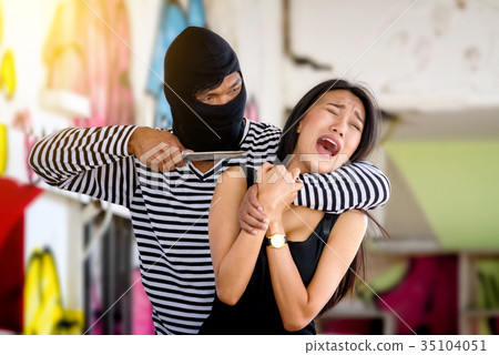 Criminal threatening with knife to scared woman Criminal threatening with knife to scared woman 35104051