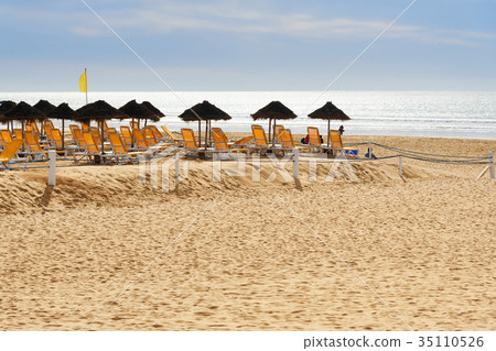 Umbrellas and chaise lounges on beach. Agadir 35110526