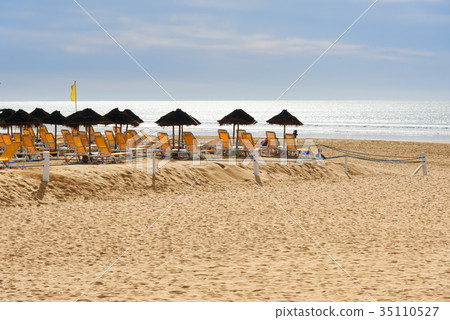 Umbrellas and chaise lounges on beach. Agadir 35110527