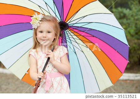 Young girl with rainbow umbrella 35113521