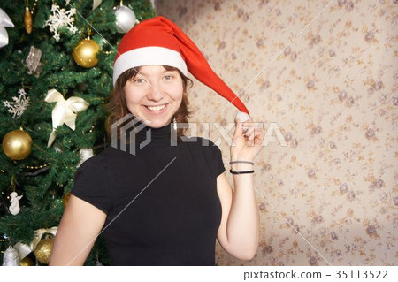 Young girl. New Year. The Christmas tree. 35113522