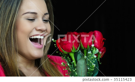 Woman Receiving Gift Of Flowers Woman Receiving Gift Of Flowers 35115423