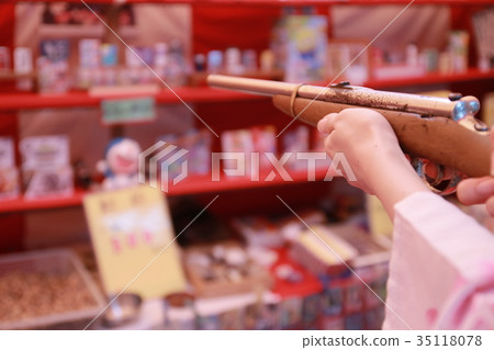 Young Yukata woman enjoying the festivities of the day Young Yukata woman enjoying the festivities of the day 35118078