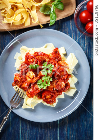 Pappardelle pasta with shrimp, tomatoes and herbs 35119766