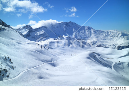 Winter mountain panorama with ski, snowboard piste Winter mountain panorama with ski, snowboard piste 35122315