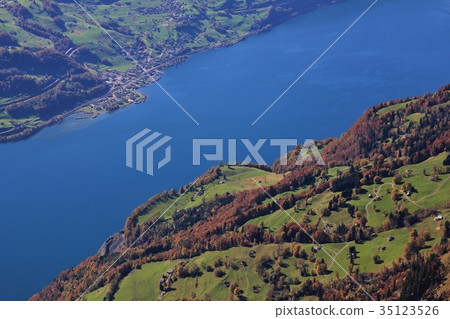 Lake Walensee and colorful forest. Walenstadtberg. Lake Walensee and colorful forest. Walenstadtberg. 35123526