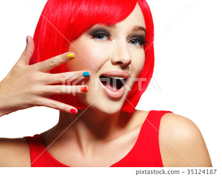 Surprised face of  pretty woman  with  red hair and multicolor n 35124187