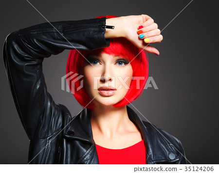 Gorgeous fashion woman with red hair and black jacket 35124206