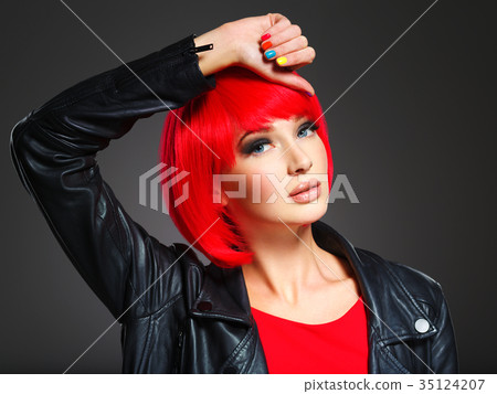 Gorgeous fashion woman with red hair and black jacket 35124207