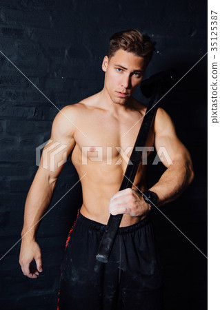 portrait of a young physically fit man workout at portrait of a young physically fit man workout at 35125387