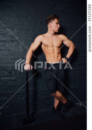 portrait of a young physically fit man workout at portrait of a young physically fit man workout at 35125388