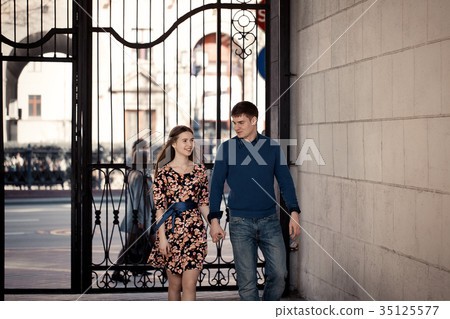 Pair in love in the city walking, laughing 35125577