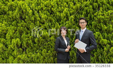 Green back businessman and business woman 35126338