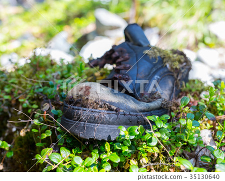 old dirty boots.old boots worn with scratches and 35130640