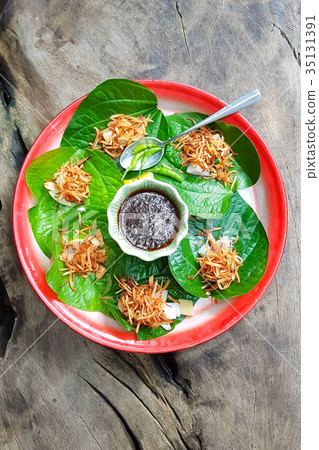 A royal leaf wrap appetizer or Savoury Leaf Wraps A royal leaf wrap appetizer or Savoury Leaf Wraps 35131391