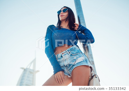 Sexy brunette woman in sunglasses. Summer photo. Sexy brunette woman in sunglasses. Summer photo. 35133342