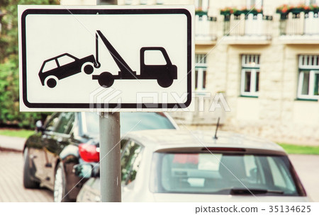 Tow away sign, no parking place, yellow filter 35134625