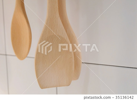 Wooden Spatula and Ladle Hanging on The Wall Wooden Spatula and Ladle Hanging on The Wall 35136142