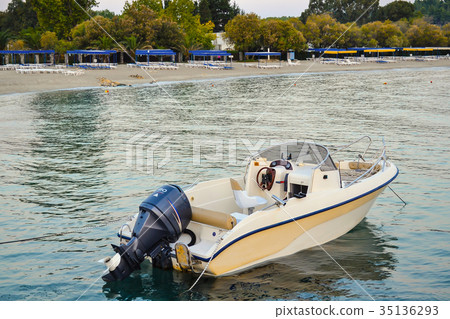 Pleasure boat moored to the shore 35136293