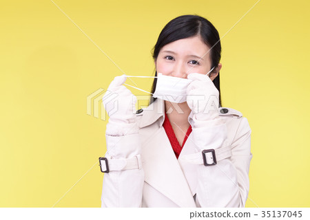 A smiling woman in a mask 35137045