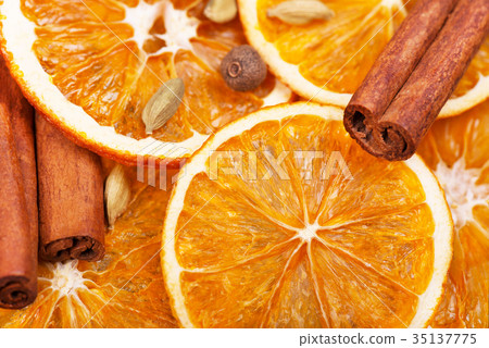 Dry slices of orange, cinnamon, allspice and Dry slices of orange, cinnamon, allspice and 35137775