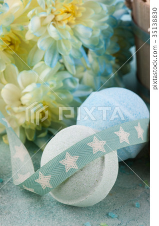 Bath bombs on blue concrete background 35138830