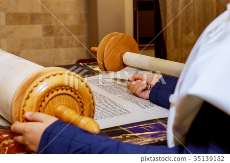 Hand of boy reading the Jewish Torah Bar Mitzvah Hand of boy reading the Jewish Torah Bar Mitzvah 35139182